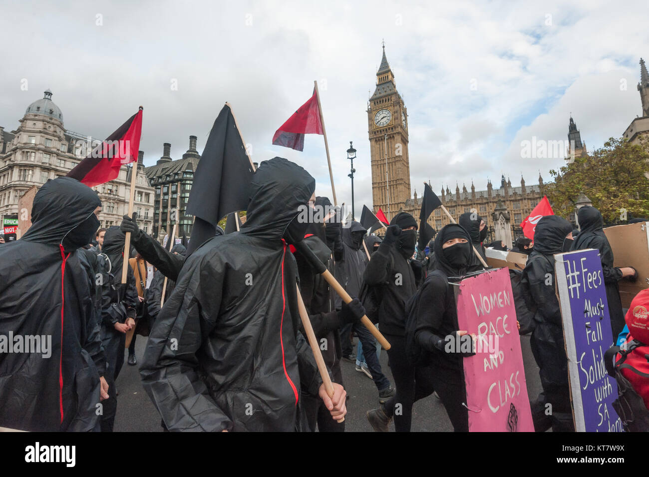 The Black bloc on the NCAFC Student march for free education - No Barriers, No Borders, No Business in Parliament Square. Stock Photo