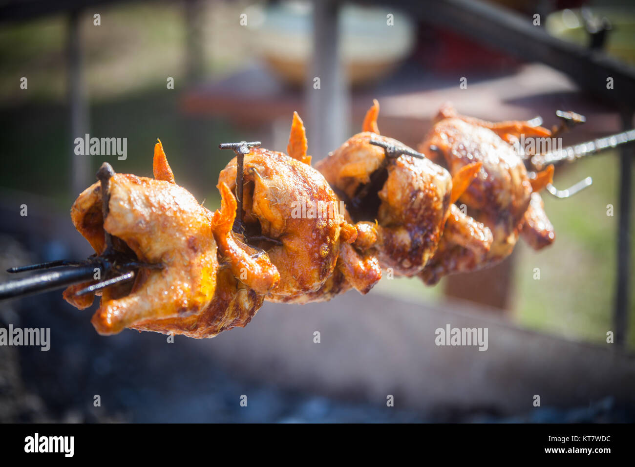 Grilled chicken on rotating machine Stock Photo Alamy