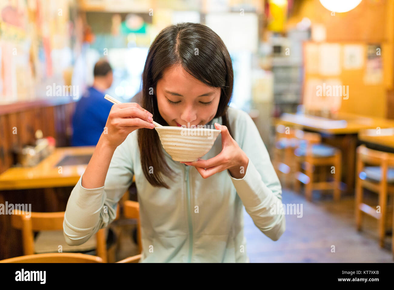 Woman eating soup in japanese restaurant Stock Photo Alamy