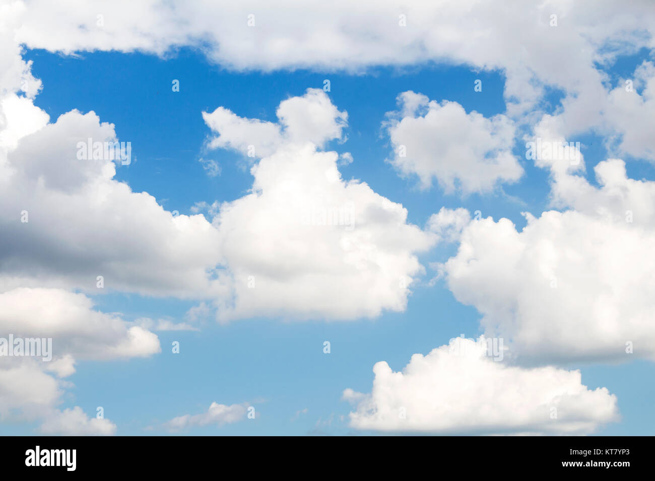 Fluffy Clouds In The Blue Sky Stock Photo - Alamy