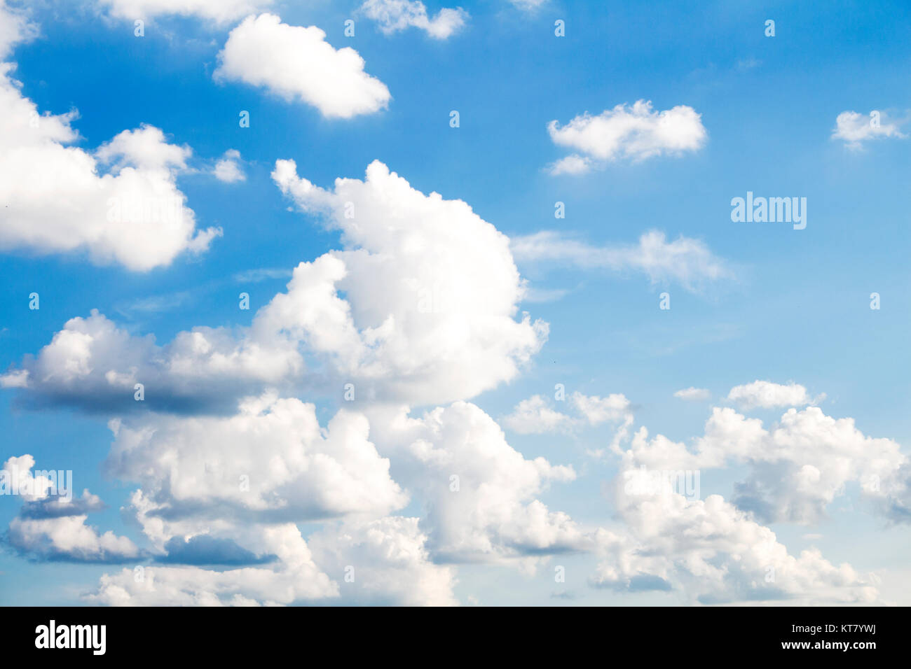 Fluffy Clouds In The Blue Sky Stock Photo - Alamy