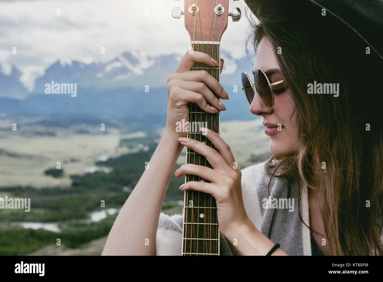 Closeup portrait of lady with guitar Stock Photo