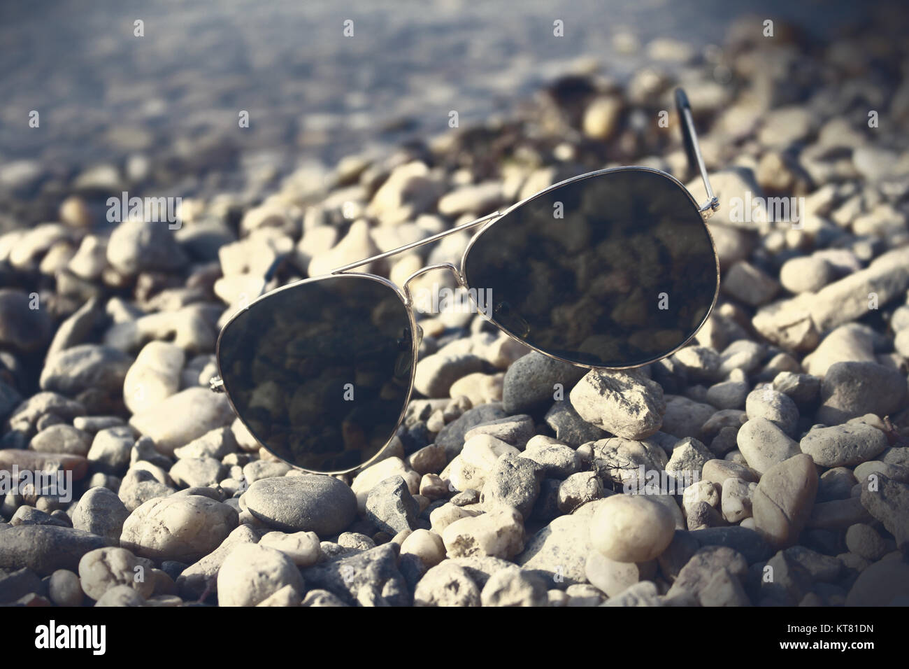 Sunglasses on the beach Stock Photo - Alamy