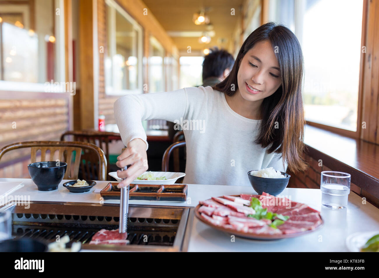 Woman enjoy roasted beef in japanese restaurant Stock Photo Alamy