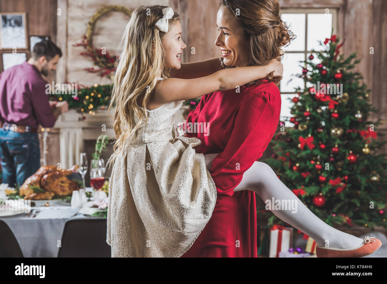 Happy mother and daughter hugging Stock Photo