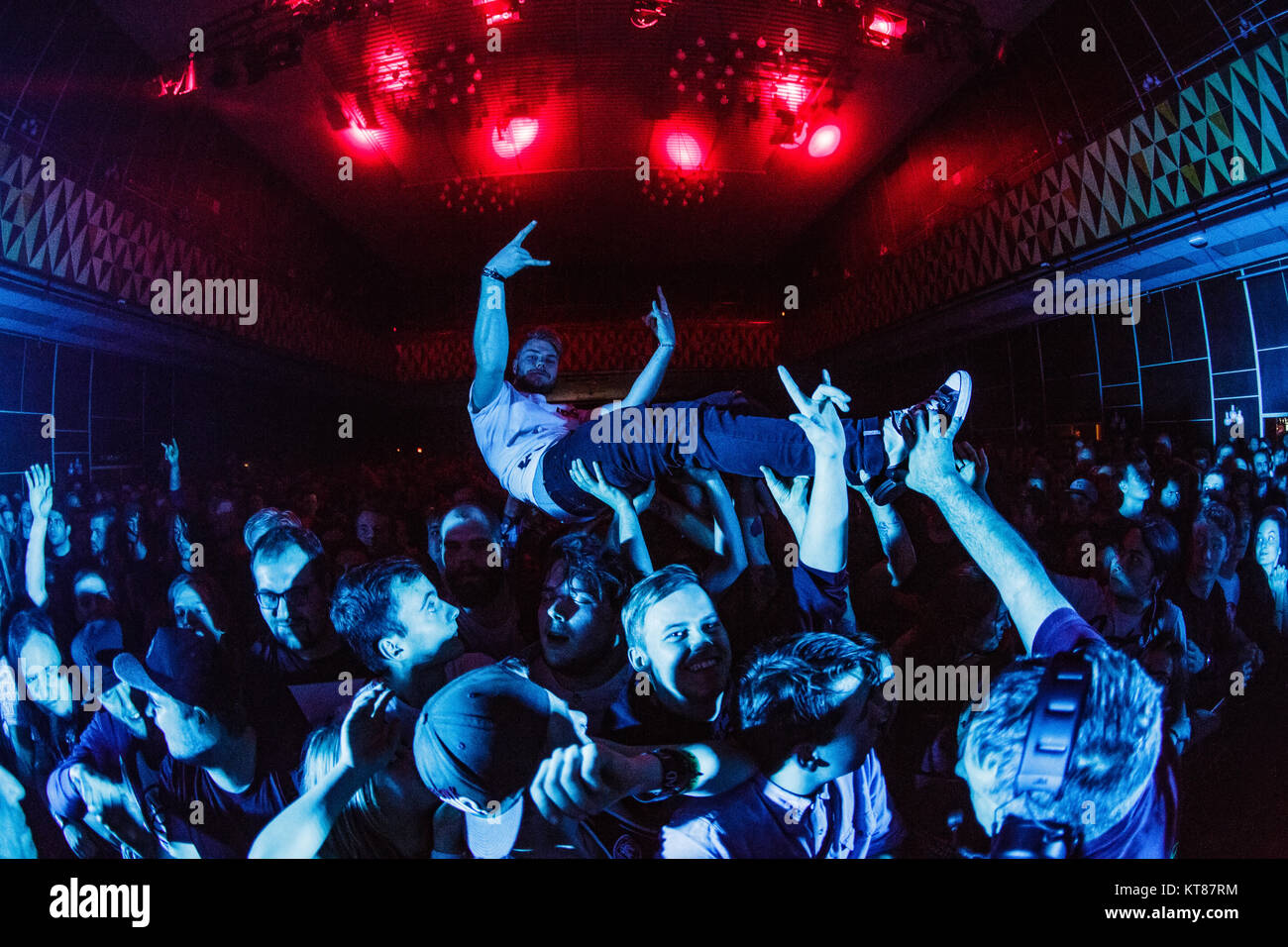 A concert goer is crowd surfing at a live concert with the British metalcore band Architects performs at VEGA in Copenhagen. Denmark, 28/01 2016. Stock Photo