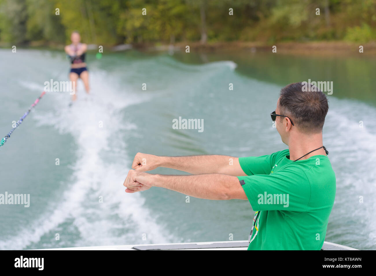 Instructor showing woman position for water skiing Stock Photo Alamy