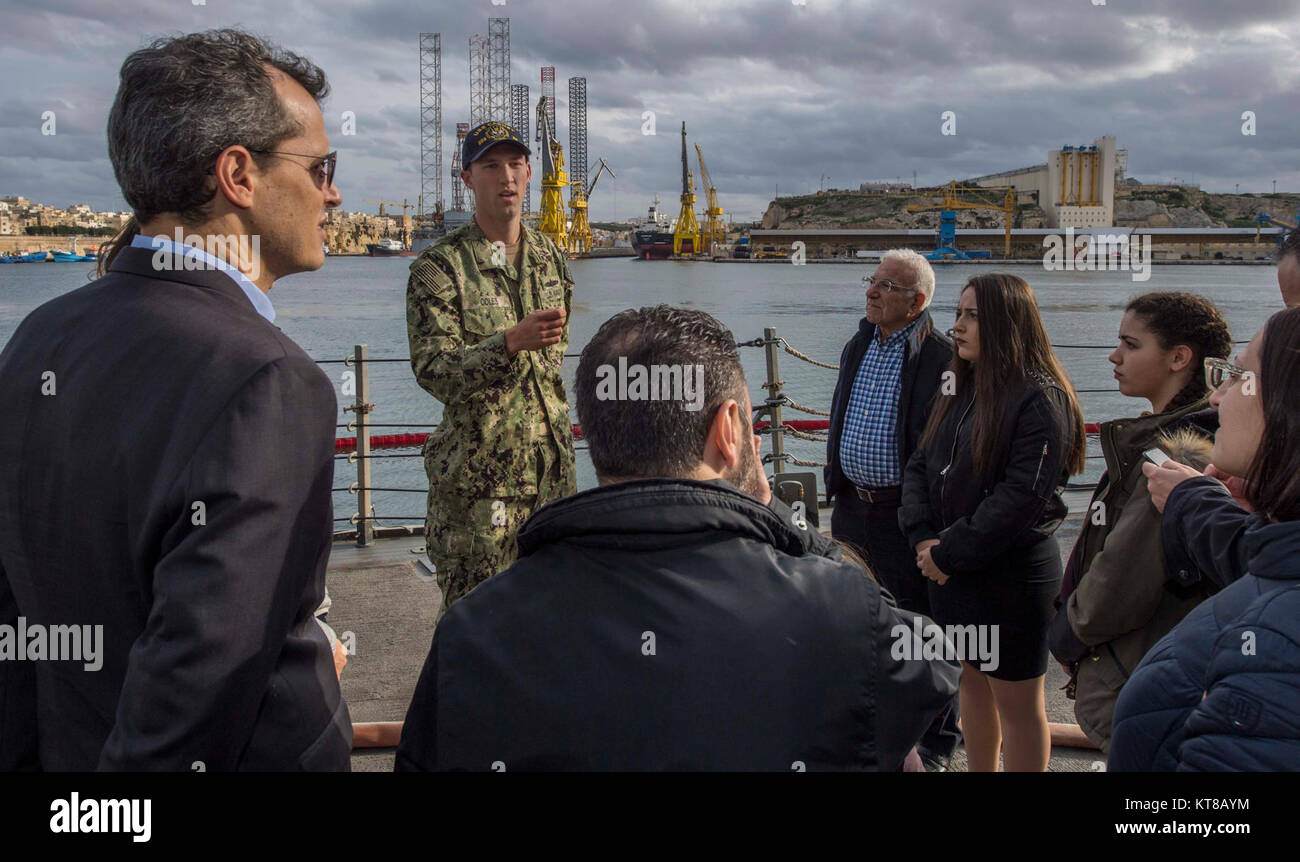– Lt. j.g. Stephen Coles , center, gives a tour of Arleigh Burke-class guided-missile destroyer USS Carney (DDG 64) during a port visit to Valletta, Malta, Dec. 10, 2017. Carney, forward-deployed to Rota, Spain, is on its fourth patrol in the U.S. 6th Fleet area of operations in support of regional allies and partners, and U.S. national security interests in Europe. (U.S. Navy Stock Photo