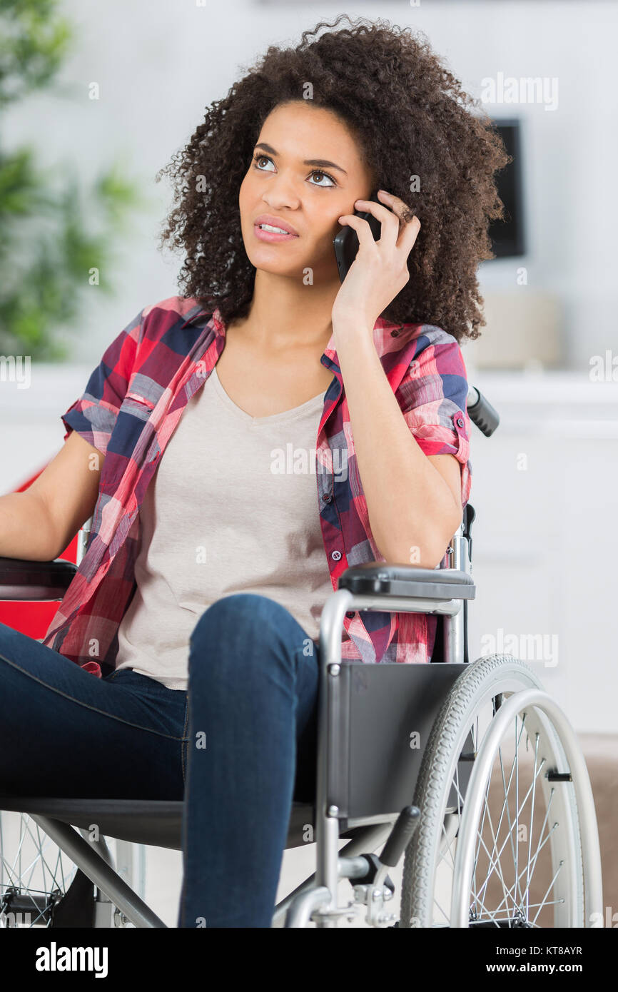 disabled woman in wheelchair making call Stock Photo - Alamy