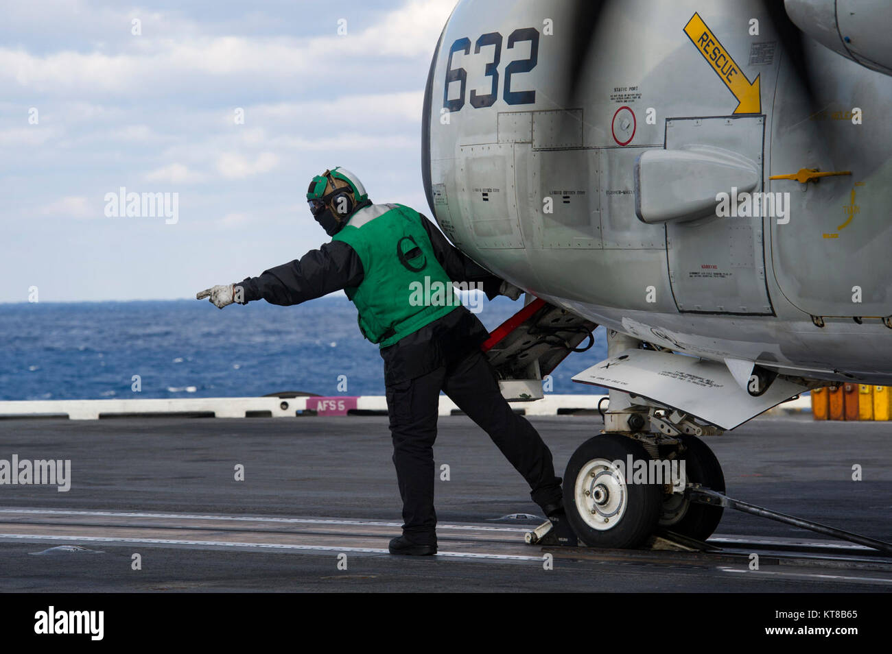 Aviation Boatswain's Mate (Equipment) 2nd Class Jared Midgett prepares a C2A Greyhound