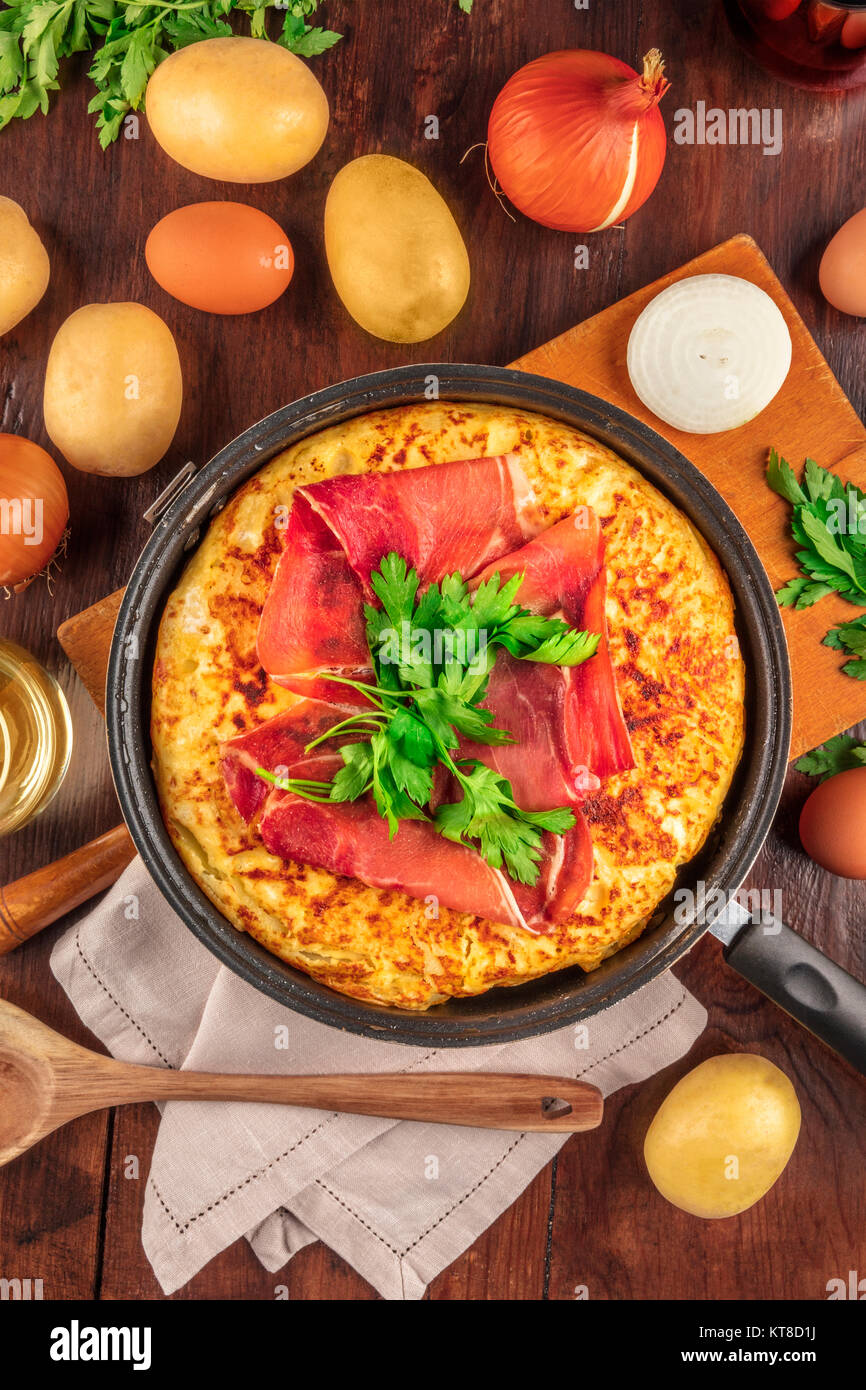 Spanish tortilla with wine, ingredients, and copy space Stock Photo Alamy