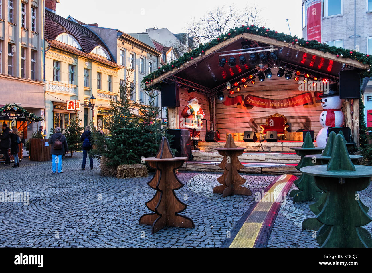 Berlin Spandau.Santa's Grotto with Father Christmas & snowman at Traditional German Christmas market in cobbled Old Town Street Stock Photo