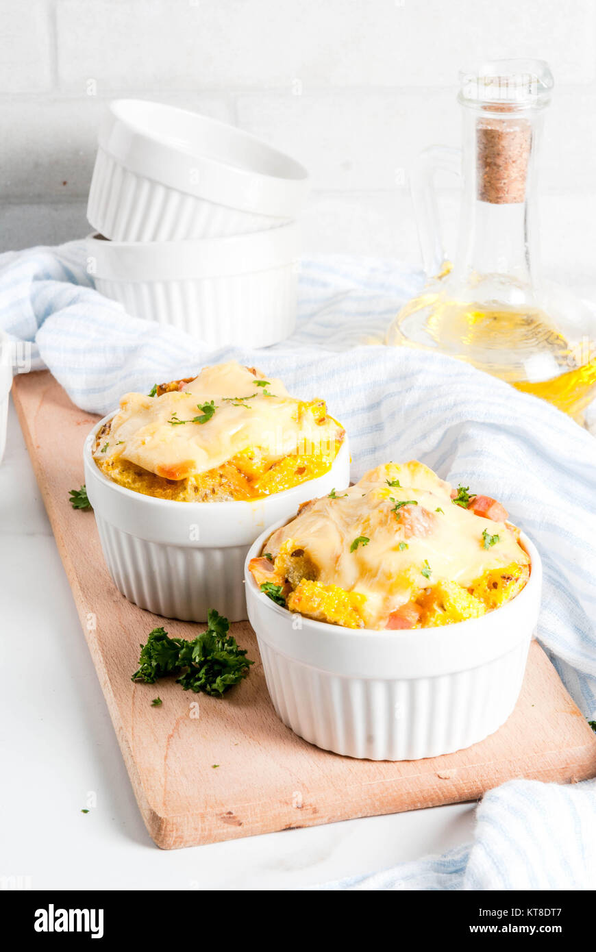 Homemade italian bread casserole strata with cheese, egg and ham, white