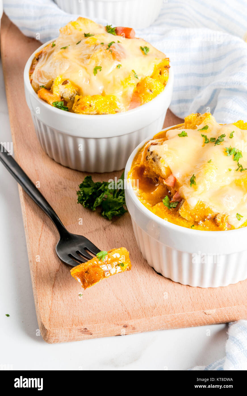 Homemade italian bread casserole strata with cheese, egg and ham, white