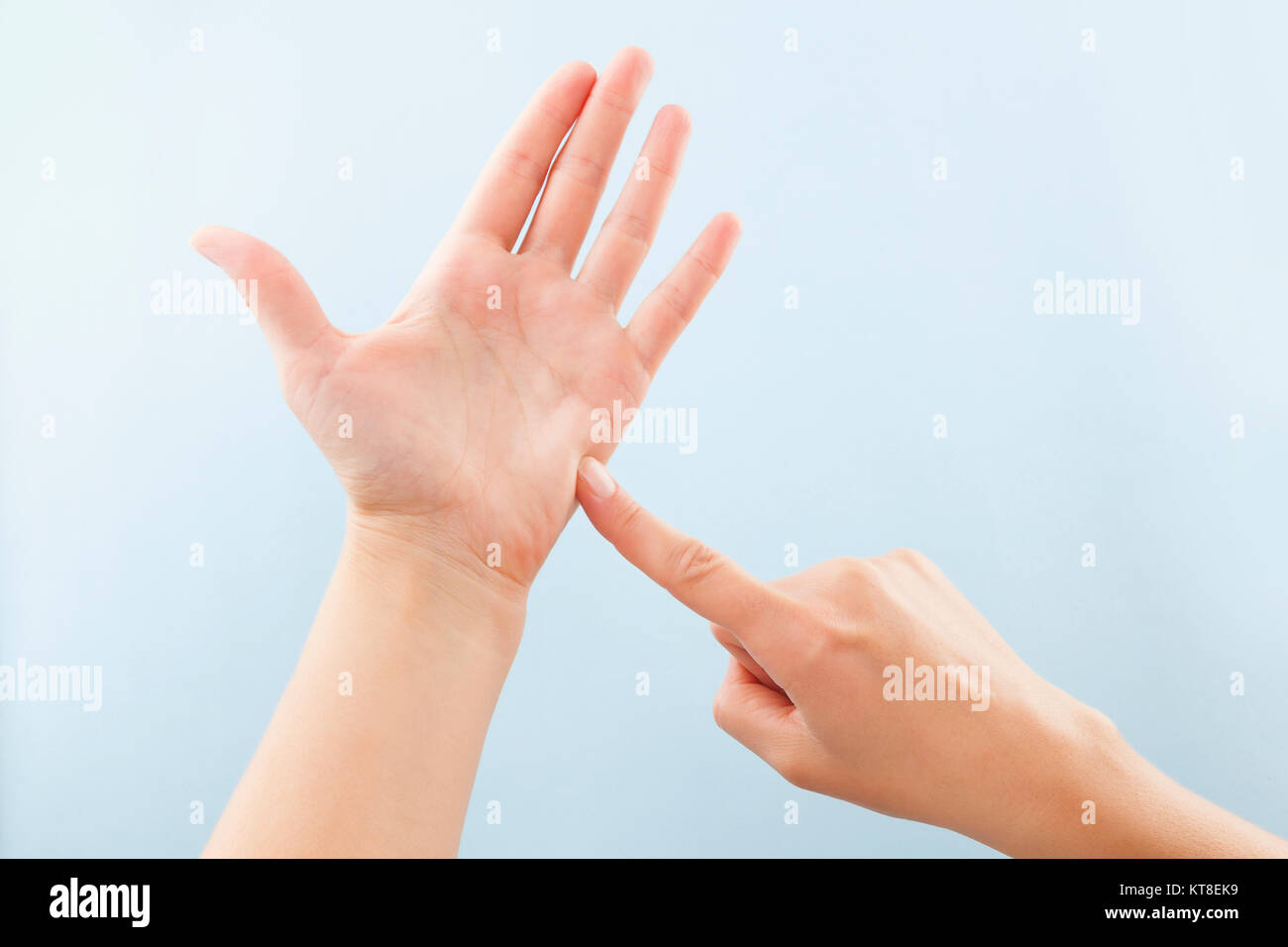 Fingerspelling alphabet. Female hands isolated on blue background