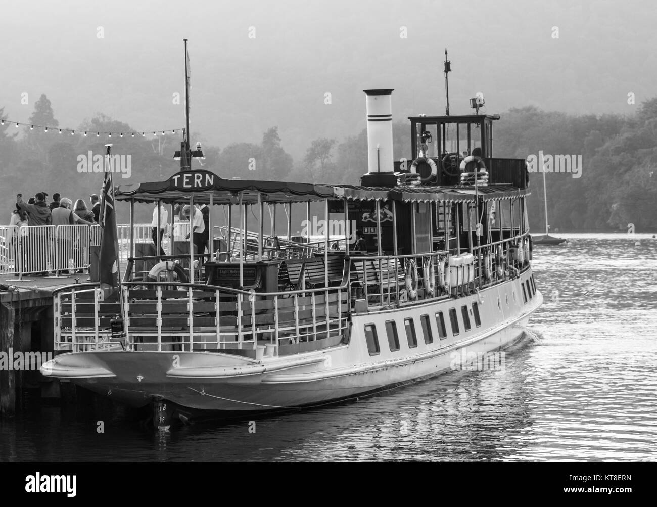 Former Steam Powered Cruise Ship 'Tern' with day-trippers at Ambleside on Lake Windermere in The Lake District, Cumbria, England, UK Stock Photo