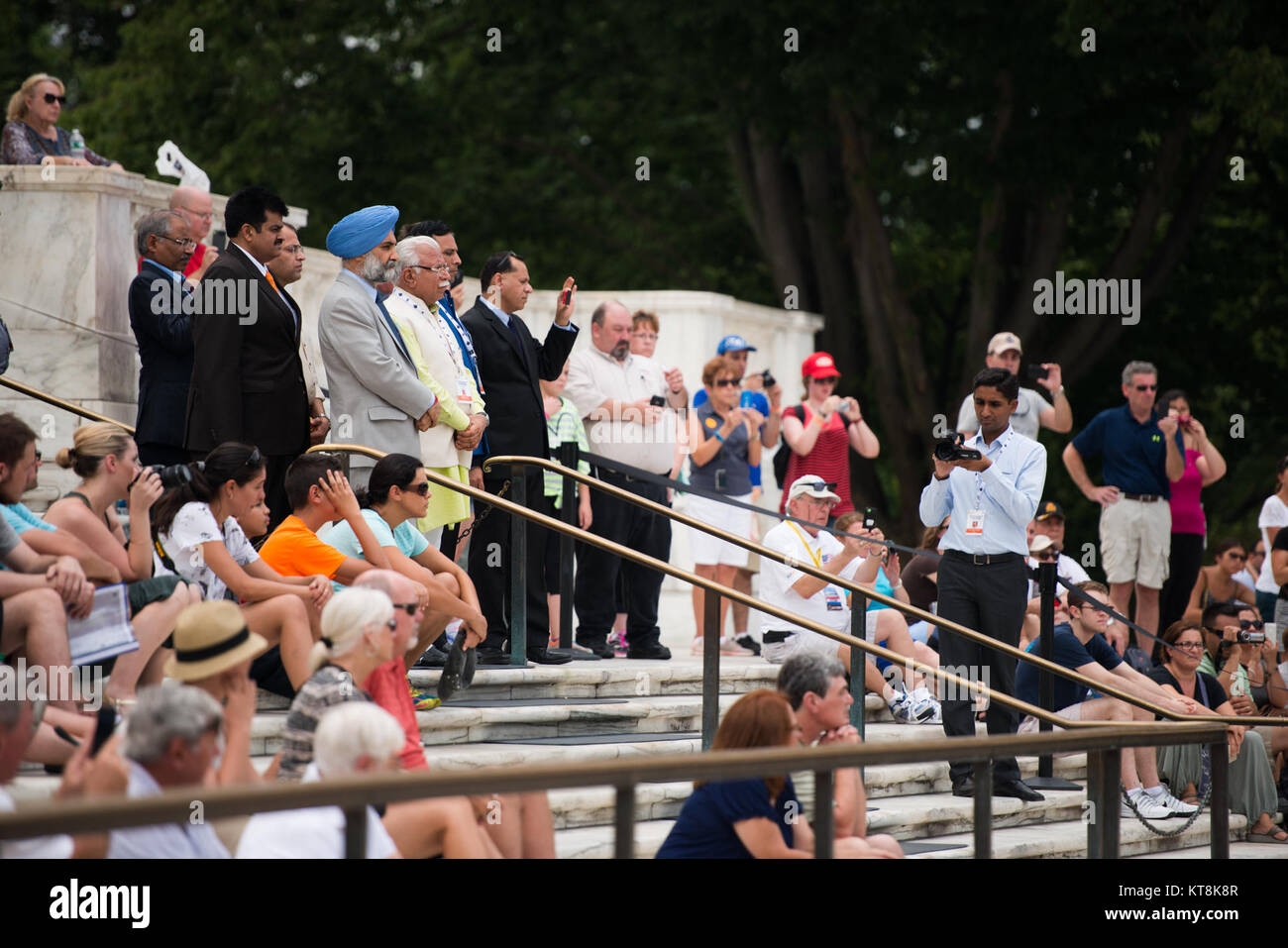 Chief Minister of Haryana, India Manohar Lal Khattar, along with others in the official party and other visitors, watch a Changing of the Guard ceremony at the Tomb of the Unknown Soldier in Arlington National Cemetery, Aug. 18, 2015, in Arlington, Va., immediately following a wreath-laying at the Space Shuttle Columbia Memorial. Kalpana Chawla, one of seven crew members killed during the Columbia disaster. She was born in Karnal, India, and was posthumously awarded the Congressional Space Medal of Honor, the NASA Space Flight Medal, and the NASA Distinguished Service Medal. (U.S. Army photo b Stock Photo