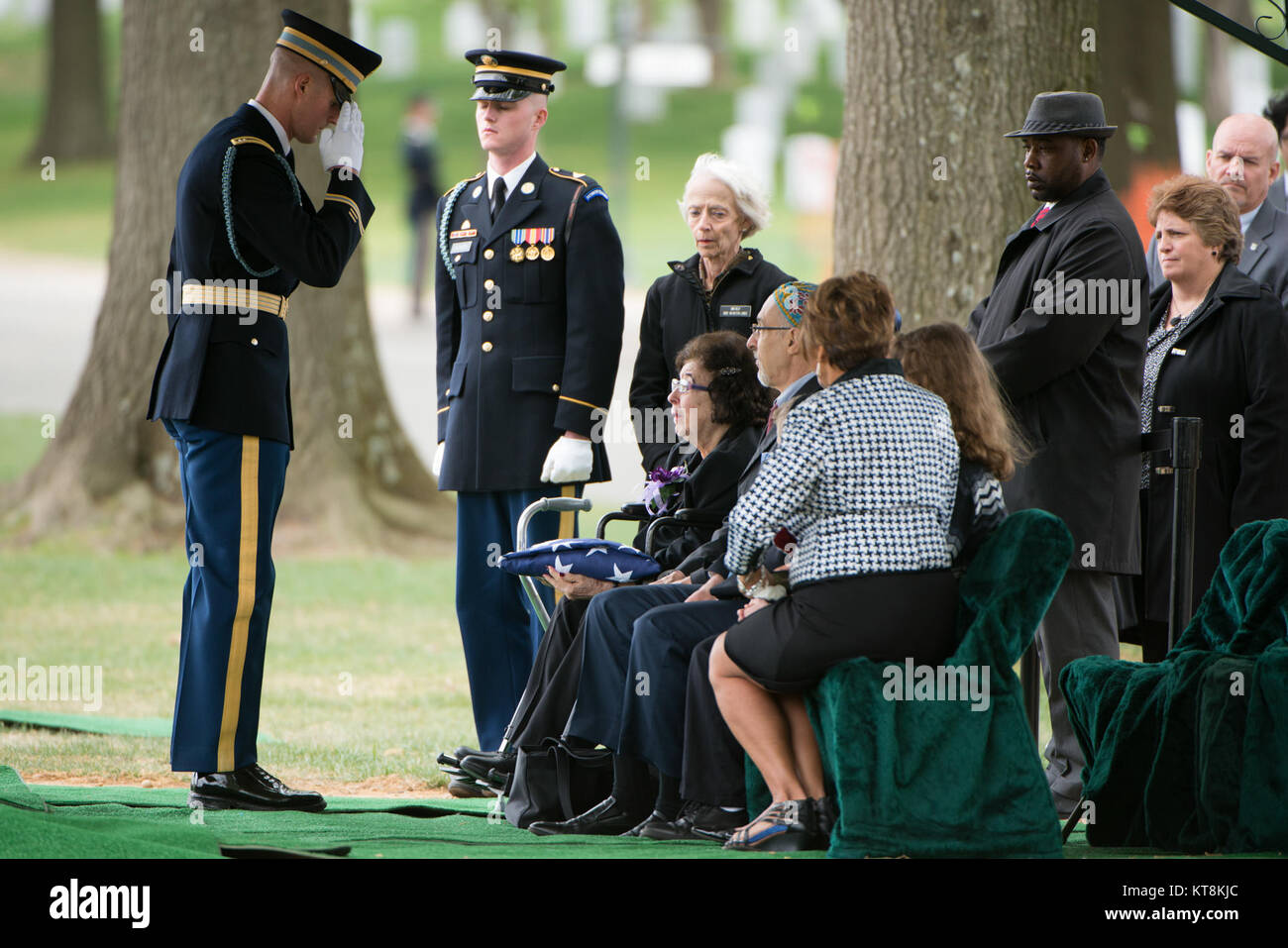 Harriet Lichtcsien-Margolis receives the American flag during the graveside service for her cousin U.S. Army Air Forces 2nd Lt. Marvin B. Rothman, 21, of Cleveland Heights, Ohio, at Arlington National Cemetery, April 19, 2017, in Arlington, Va. Rothman went missing during a bombing escort mission, April 11, 1944, flying a P-47D Thunderbolt over New Guinea. His remains were recently found and identified. (U.S. Army photo by Rachel Larue/Arlington National Cemetery/released) Stock Photo