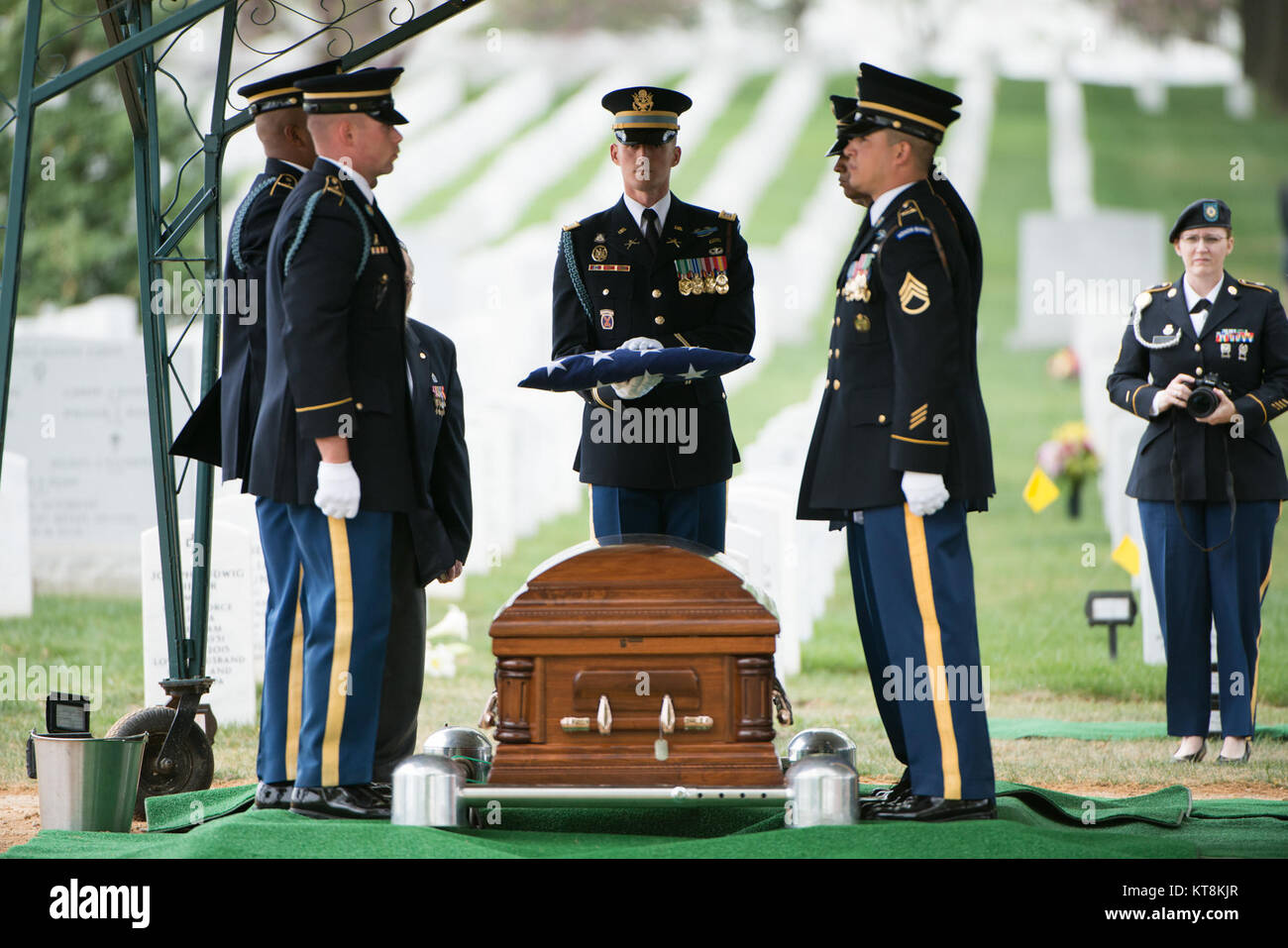 Members of the 3d U.S. Infantry Regiment (The Old Guard) participate in the graveside service for U.S. Army Air Forces 2nd Lt. Marvin B. Rothman, 21, of Cleveland Heights, Ohio, at Arlington National Cemetery, April 19, 2017, in Arlington, Va. Rothman went missing during a bombing escort mission, April 11, 1944, flying a P-47D Thunderbolt over New Guinea. His remains were recently found and identified. (U.S. Army photo by Rachel Larue/Arlington National Cemetery/released) Stock Photo
