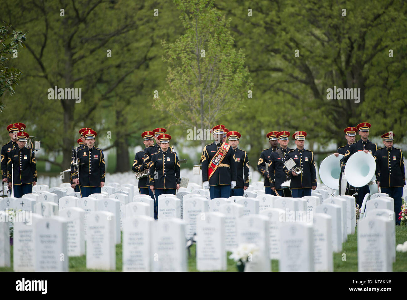 Members of the U.S. Army Band, “Pershing’s Own,” participate in the graveside service for U.S. Army Air Forces 2nd Lt. Marvin B. Rothman, 21, of Cleveland Heights, Ohio, at Arlington National Cemetery, April 19, 2017, in Arlington, Va. Rothman went missing during a bombing escort mission, April 11, 1944, flying a P-47D Thunderbolt over New Guinea. His remains were recently found and identified. (U.S. Army photo by Rachel Larue/Arlington National Cemetery/released) Stock Photo