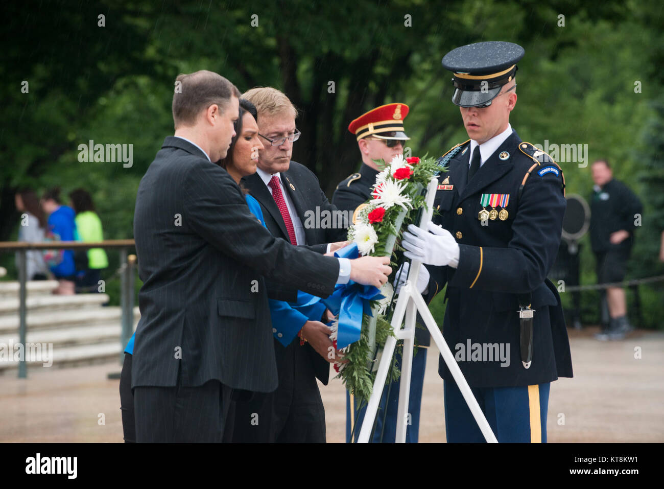 From the left, Reps. Jim Bridenstine of Oklahoma’s First District, Tulsi Gabbard of Hawaii Second District and Paul Cook of California’s Eighth District, lay a wreath at the Tomb of the Unknown Soldier in Arlington National Cemetery, May 21, 2015, in Arlington, Va., on behalf of the sophomore class of the 114th Congress. Dignitaries from all over the world pay respects to those buried at Arlington National Cemetery in more than 3,000 ceremonies each year. (U.S. Army photo by Rachel Larue/Released) Stock Photo