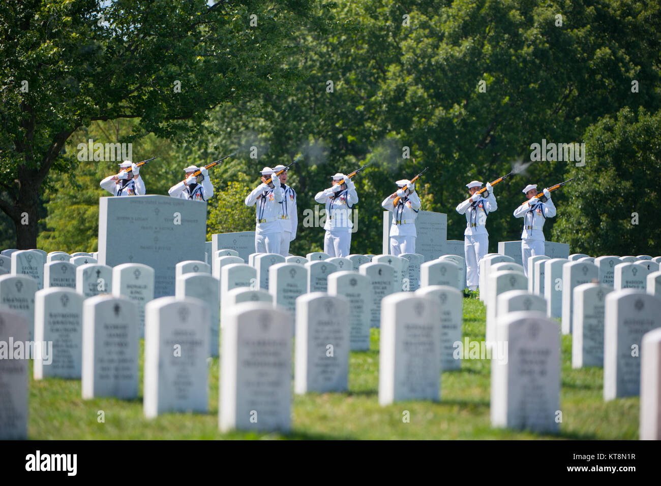 The U.S. Navy Honor Guard participates in the graveside service for U.S. Navy Petty Officer 1st Class Xavier A. Martin at Arlington National Cemetery, Arlington, Va., Aug. 9, 2017.  Martin perished when the USS Fitzgerald (DDG 62) was involved in a collision with the Philippine-flagged merchant vessel ACX Crystal, flooding the berthing compartment he was occupying.  Martin was buried with standard honors in Section 60. (U.S. Army photo by Elizabeth Fraser / Arlington National Cemetery / released) Stock Photo