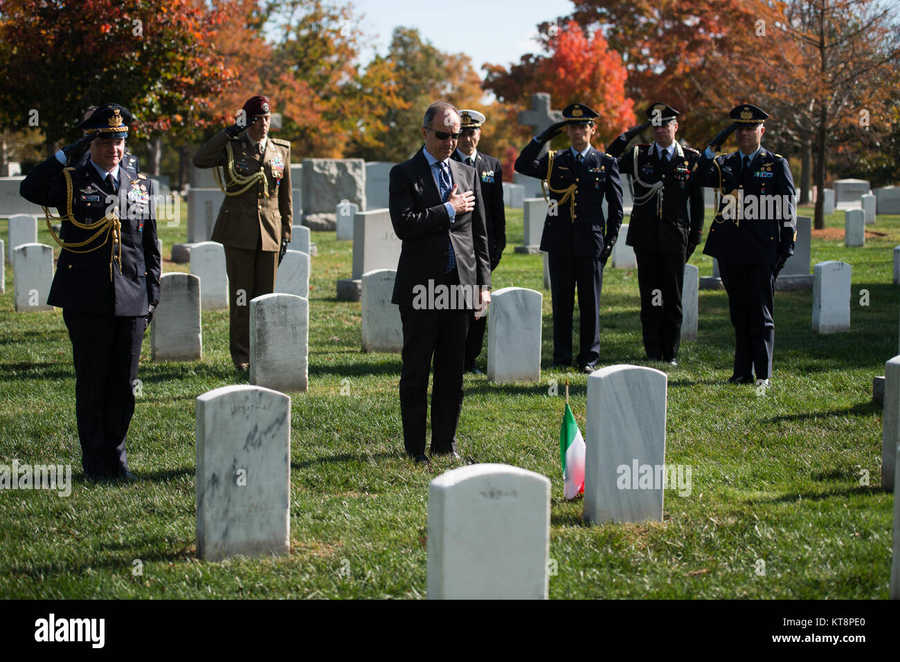 Armando Varricchio, center, Ambassador of Italy to the United States, and Maj. Gen. Luca Goretti, left, Italian Defense Attaché to the Italian Embassy, render honors after placing an Italian flag on the gravesites of Mario Batista and Cpl. Arcangelo Prudenza in Arlington National Cemetery, Nov. 4, 2016, in Arlington, Va. Varricchio also laid a wreath at the Tomb of the Unknown Soldier. (U.S. Army photo by Rachel Larue/Arlington National Cemetery/released) Stock Photo
