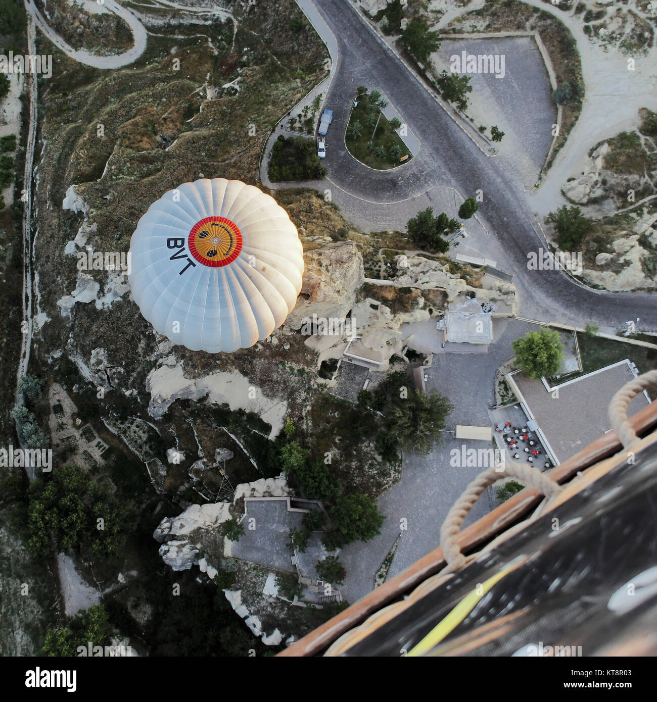 Goereme, Anatolia, Turkey, July 3rd 2015: View from above onto a balloon and the entrance of the Goereme open-air museum. Stock Photo