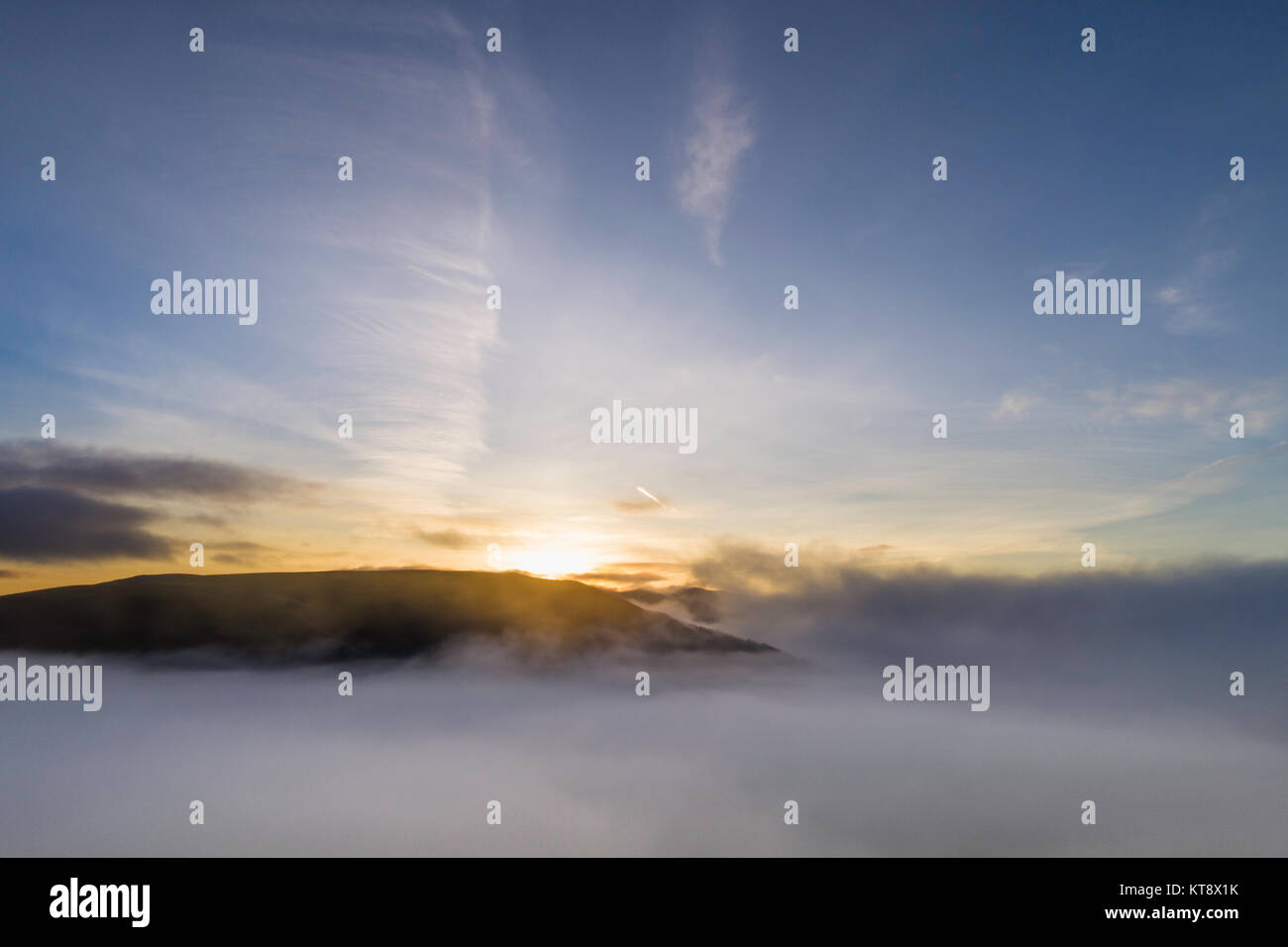 Keswick, UK. 22nd Dec, 2017. Drone aerial image of sunrise over the mist over Keswick Credit: Russell Millner/Alamy Live News Stock Photo