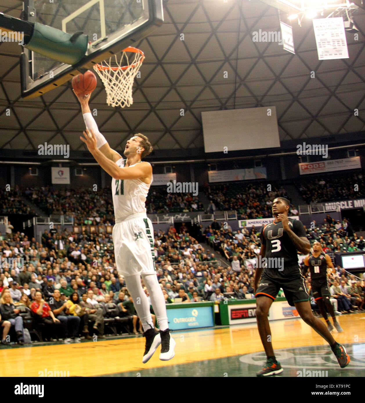 Honolulu, Hawaii. 22nd Dec, 2017. Hawaii Rainbow Warriors forward Gibson Johnson (21) puts in an easy lay up during game between #6 Miami (Fl) Hurricanes and the Hawaii Rainbow Warriors at the Hawaiian Airlines Diamond Head Classic at the Stan Sheriff Center on the campus of the University of Hawaii in Honolulu, Hawaii - Michael Sullivan/CSM Credit: Cal Sport Media/Alamy Live News Stock Photo