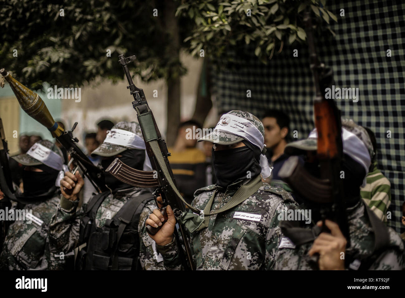 Armed members of Abd al-Qadir al-Husayni Brigades, one of the military branches of the Fatah organization, attend the protest funeral of 29-year-old Mohammed Mohaisen in Gaza City, Gaza Strip, the Palestinian Territories, 23 December 2017. A day earlier, Mohaisen was killed during clashes with Israeli soldiers following protests against US President Donald Trump's decision to recognise Jerusalem as the capital of Israel. Photo: Mohammed Talatene/dpa Stock Photo