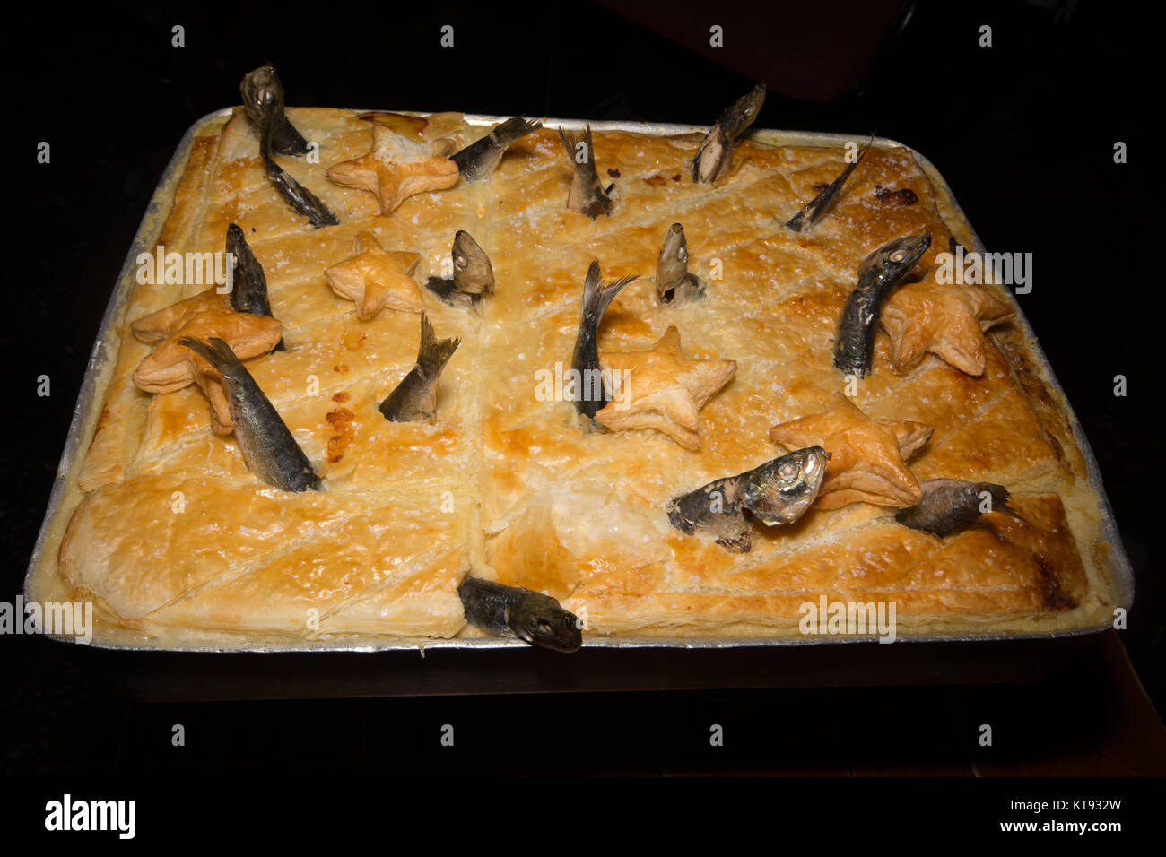 pie with fish heads sticking out pie with fish heads sticking out