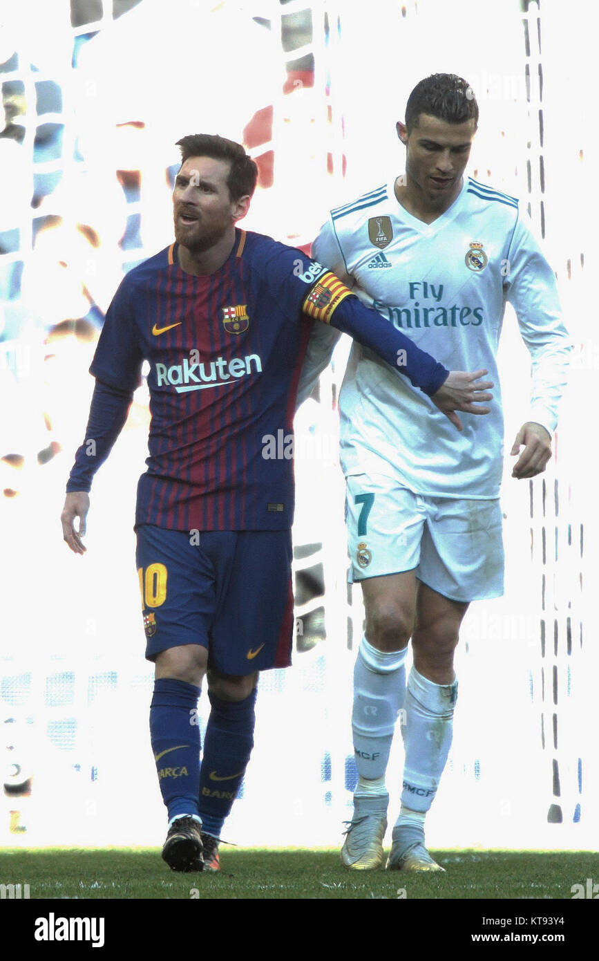 Madrid, Spain. 23rd Dec, 2017. Real Madrid's Cristiano Ronaldo (R) and Barcelona's Lionel Messi walk side by side at the end of the Spanish La Liga soccer match between Real Madrid and Barcelona at the Santiago Bernabeu stadium in Madrid, Spain, on Dec. 23, 2017. Barcelona beat Real Madrid by 3-0. Credit: Juan Carlos Rojas/Xinhua/Alamy Live News Stock Photo
