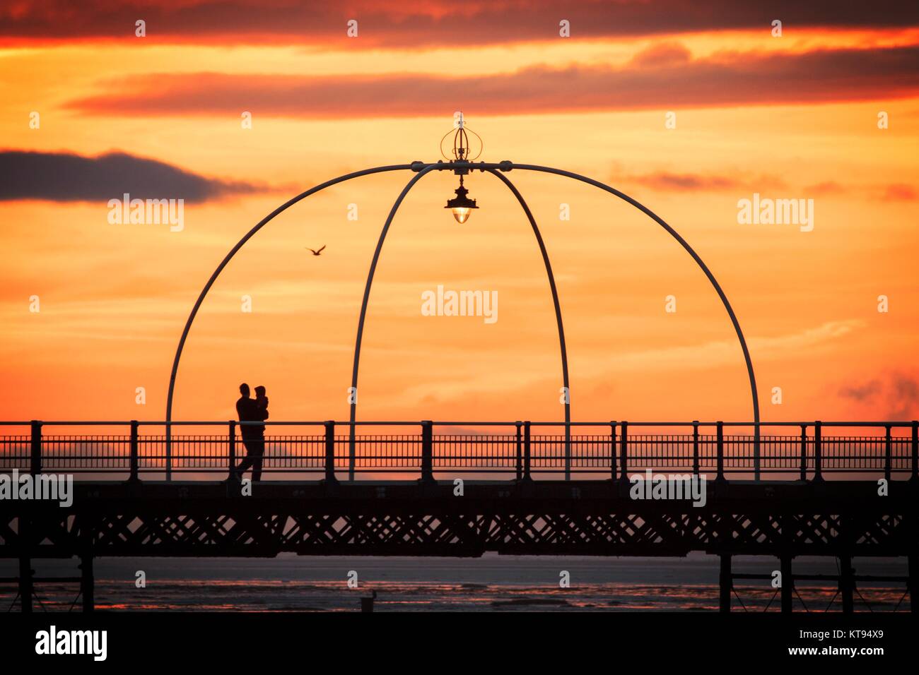 Southport, Merseyside, 23rd December 2017. Sunset over Southport. UK Weather. After a grey dull