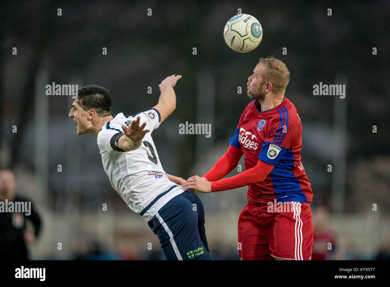 Guiseley, UK. 23rd Dec, 2017. Scott Rendell (Aldershot Town) wins the ...