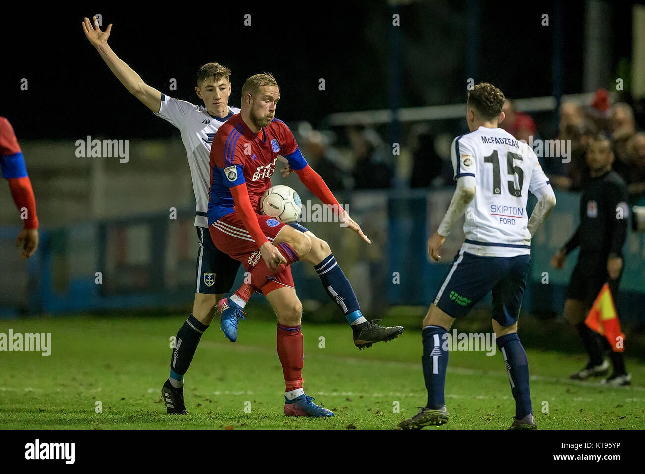 Guiseley, UK. 23rd Dec, 2017. Scott Rendell (Aldershot Town) controls ...
