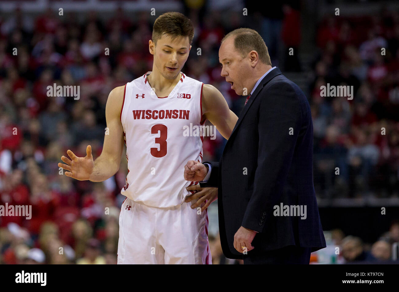 Madison, WI, USA. 23rd Dec, 2017. Wisconsin Badgers guard Walt McGrory #3 talks with Wisconsin coach Greg Gard during the NCAA Basketball game between the Green Bay Phoenix and the Wisconsin Badgers at the Kohl Center in Madison, WI. Wisconsin defeated Green Bay 81-60. John Fisher/CSM/Alamy Live News Stock Photo