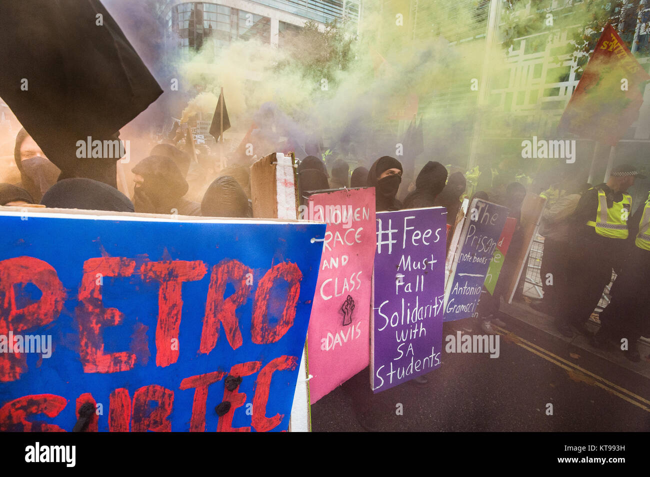 The autonomous bloc on the student march let off flares and threw objects at the police guarding the Home Office. They called for an end to the UK's racist immigration policies aned shameful treatment of refugees and asylum seekers. Stock Photo