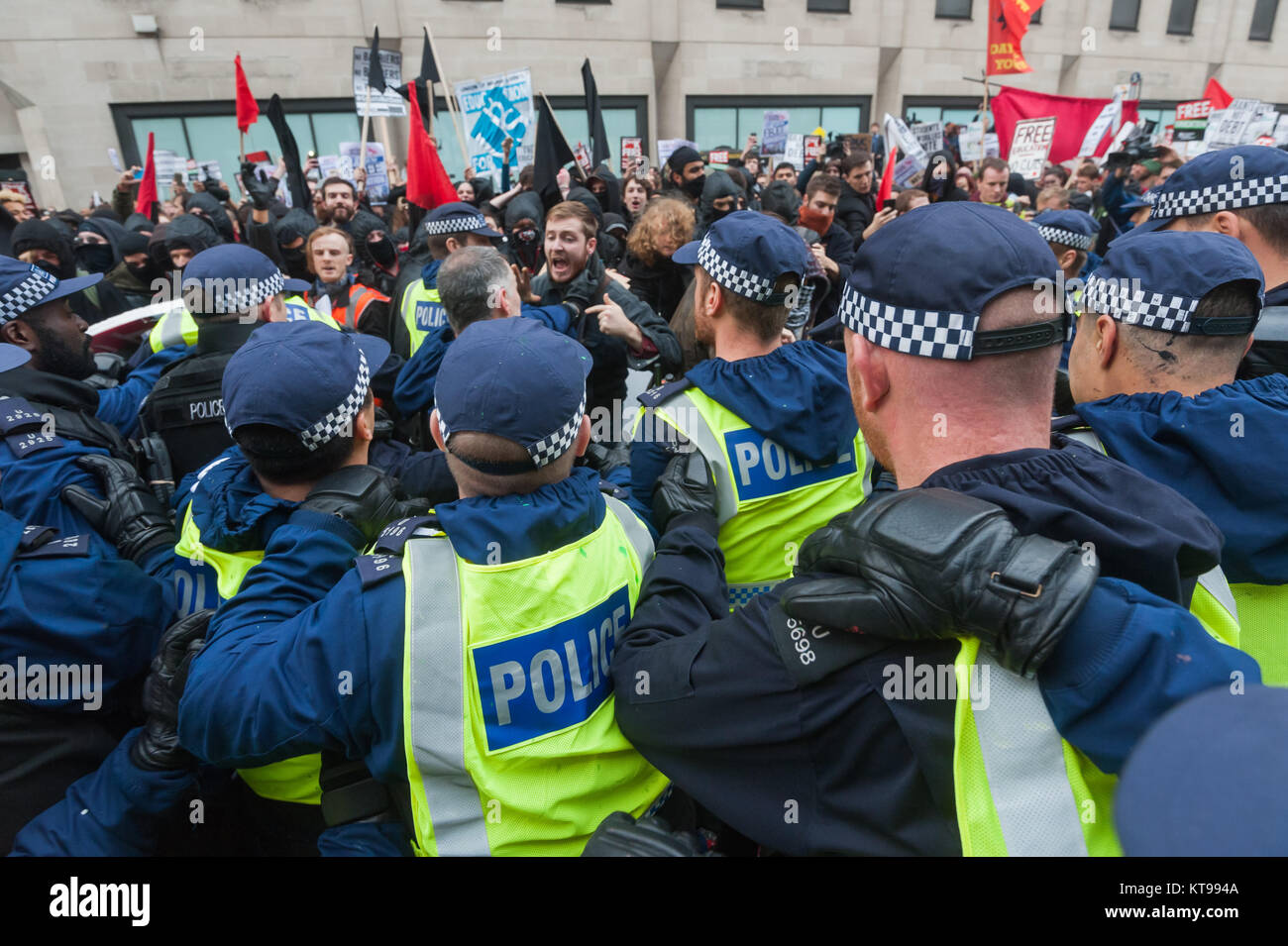 As the autonomous block attempted to march away from the Dept for Business, Innovation & Skills they and several photographers were attacked by a large crowd of police who rushed in and started throwing people about. Stock Photo