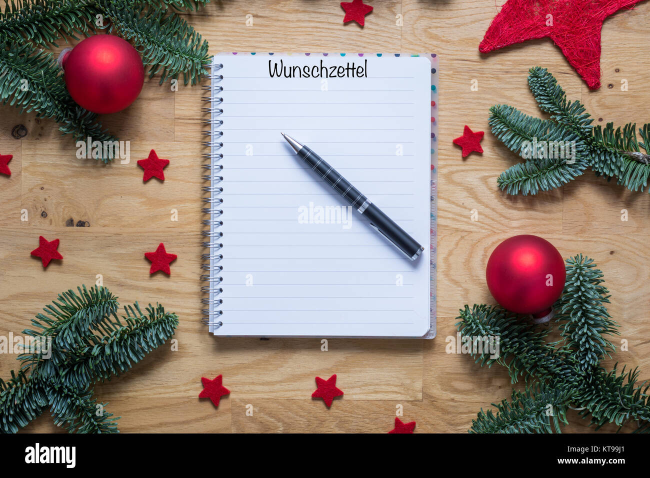 Wish list for Christmas in German on a notepad with Christmas ...