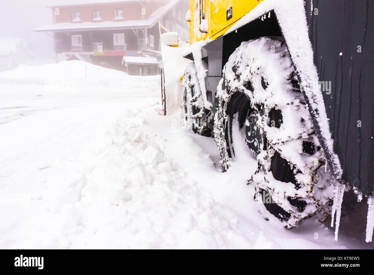 Closeup of a chained wheel of a snowy snow plow with copy space - - Vosges (France) - december 2017 Stock Photo