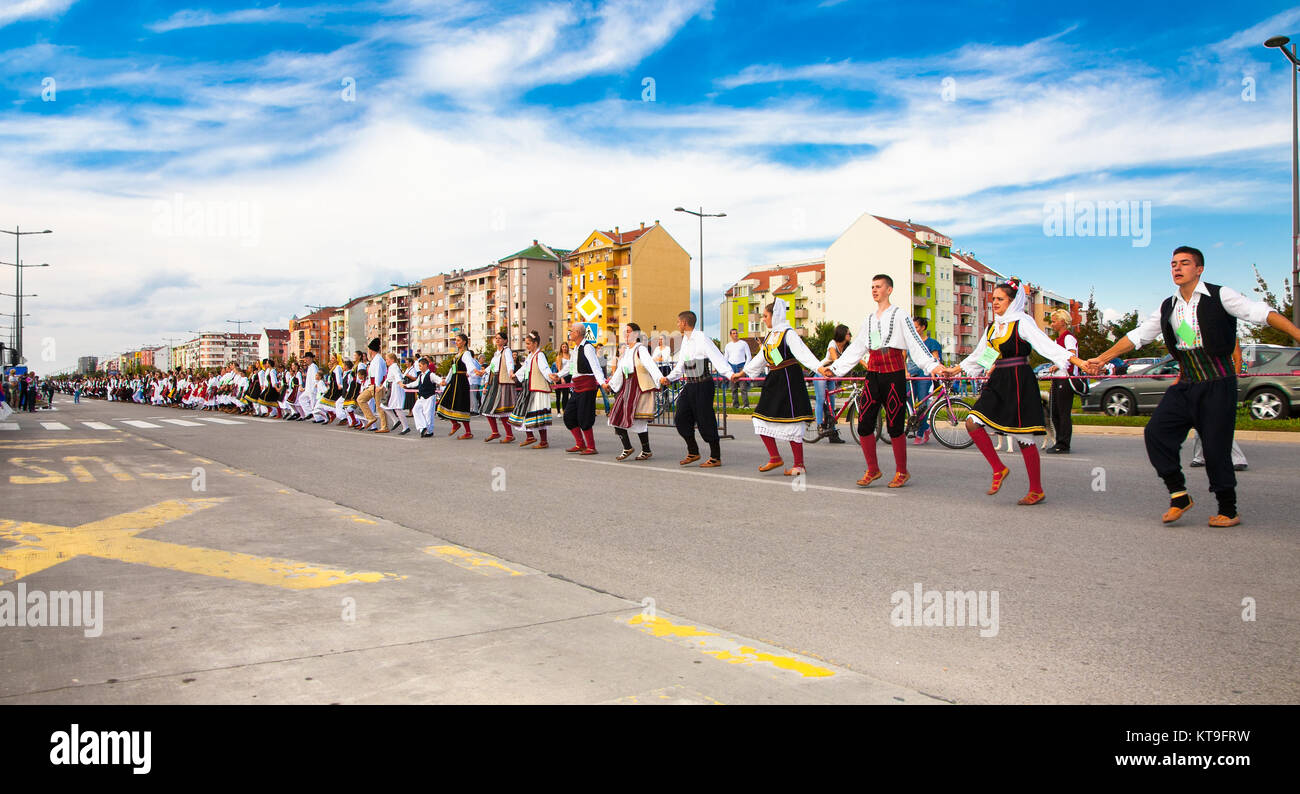 NOVI SAD, SERBIA-OCT 4, 2015: Guinness World Record Largest Folk Dance on Oct 4. 2015 in Novi Sad, Serbia. Over 12.000 participants break the Guinness Stock Photo