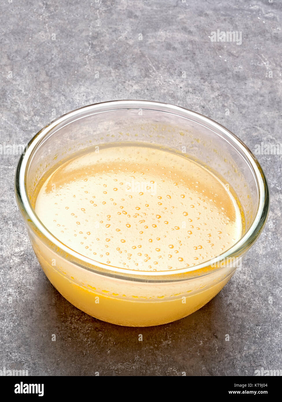 gelatinous chicken soup broth Stock Photo Alamy