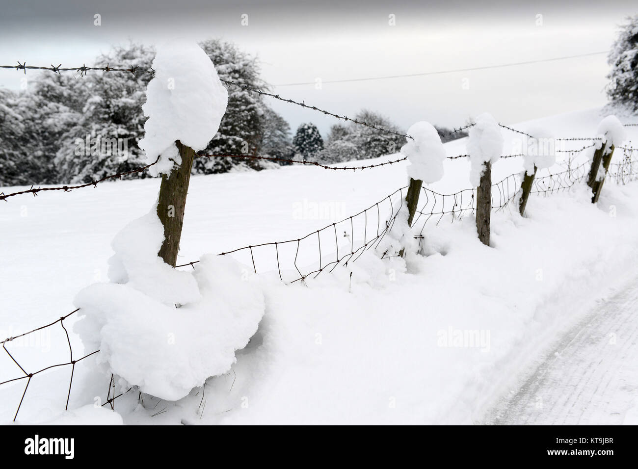 Deep snow on barbed wire fence winter 2017 Stock Photo - Alamy