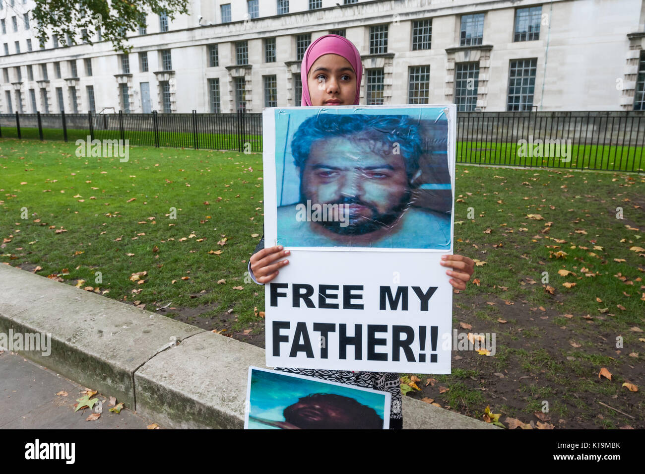 Zainab Omar (10) at the protest for Shaker Aamer holds a poster for the release of her father Shawki Ahmed Omar,held by the US in Iraq in 2004, tortured and still in an Iraqi jail. She was born after his arrest and has never seen her father. Stock Photo