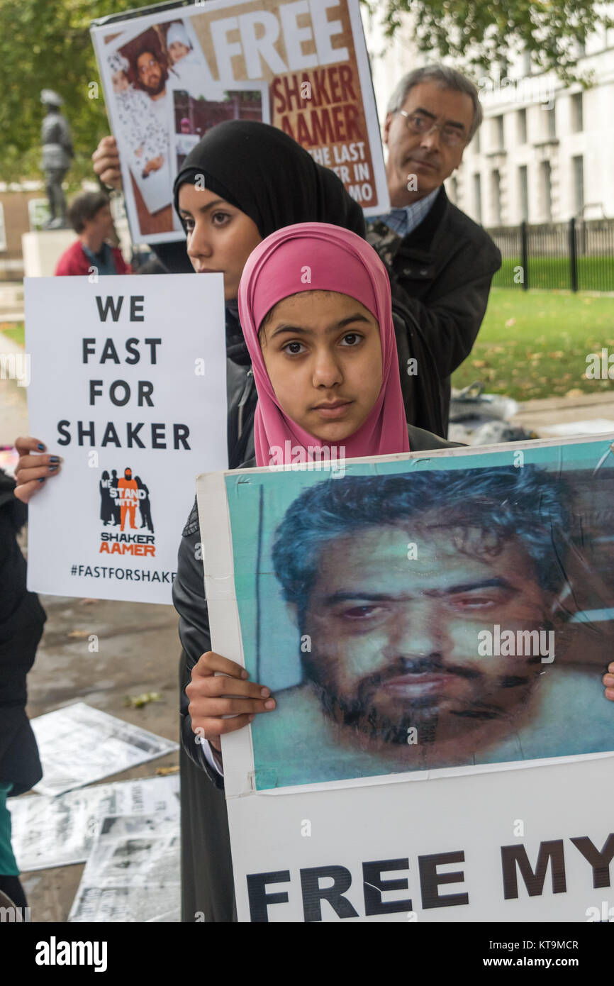 Zainab Omar (10) whose father Shawki Ahmed Omar is still in indefinite detention in Iraq after her parents were arrested and tortured by the US in Iraq in 2004 stands with the other protesters calling for his release. Stock Photo