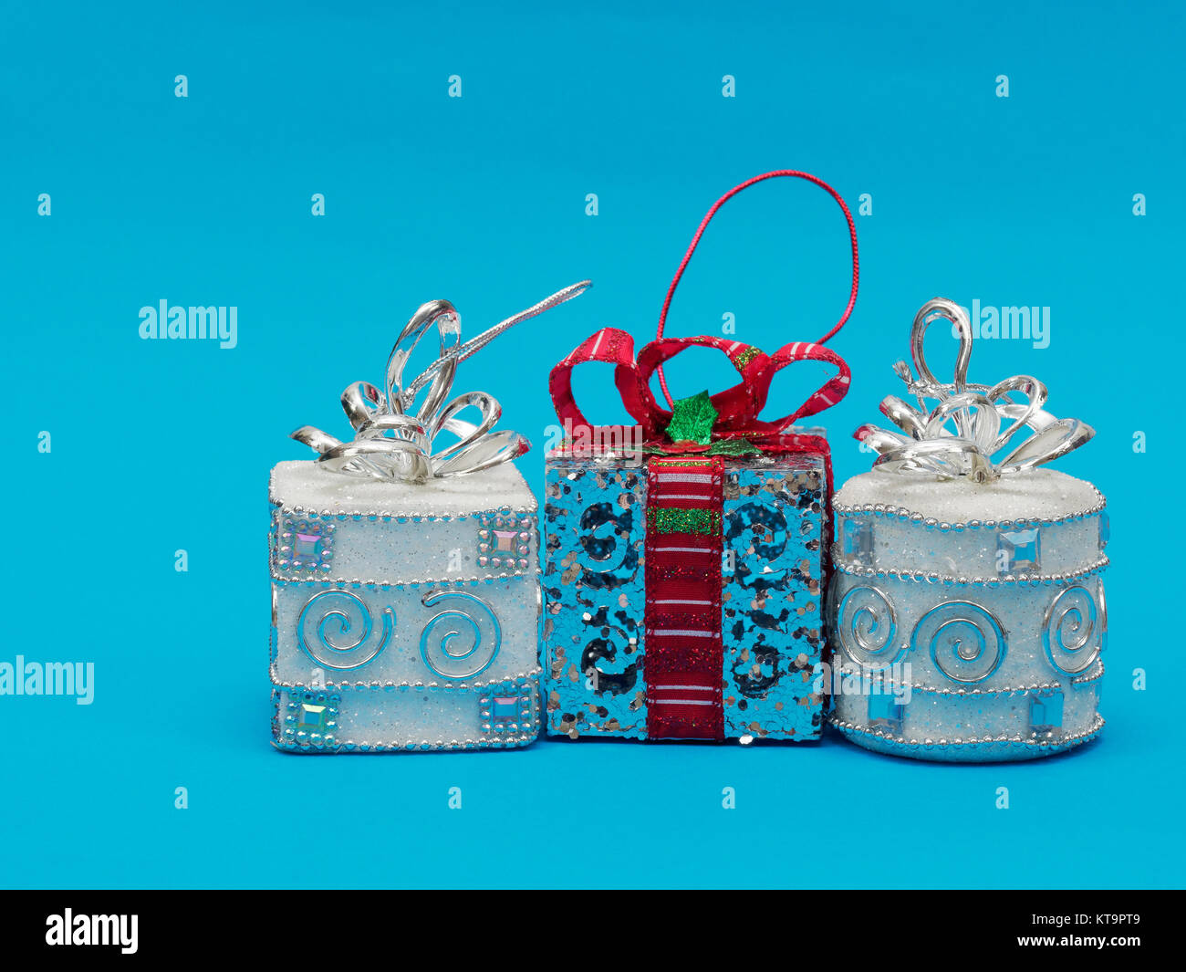 White shiny silver gift box with red ribbon and bow and silver white ...