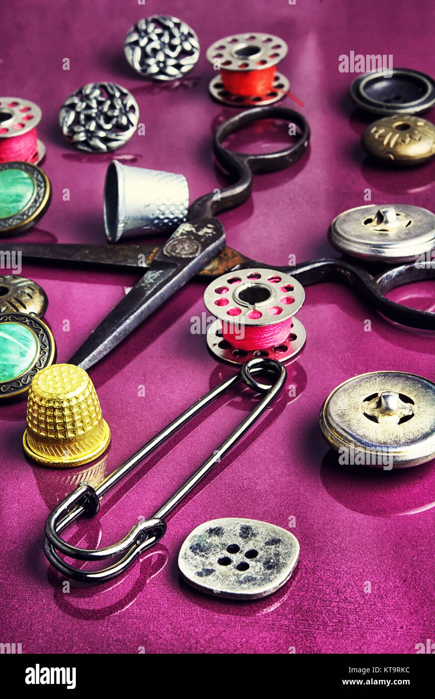 Set of beautiful buttons,sewing needle and bobbin Stock Photo - Alamy