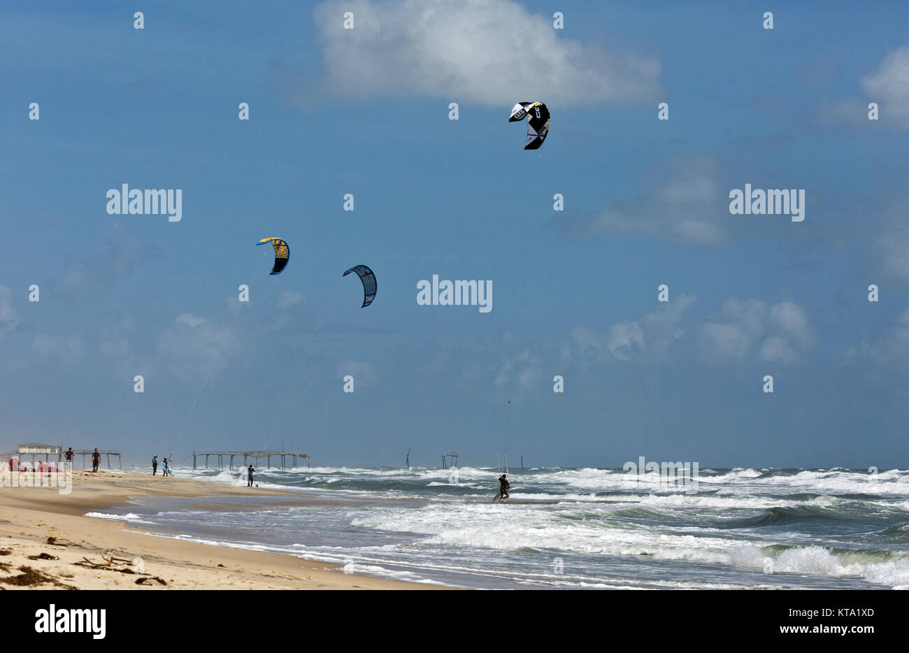 NC0113500...NORTH CAROLINA Kitesurfers heading out into the Atlantic Ocean on a windy day