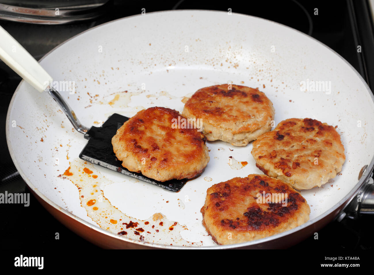 Turkey Burgers Finished Cooking in a Pan Stock Photo Alamy